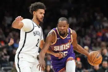 Durant dribbles against Johnson