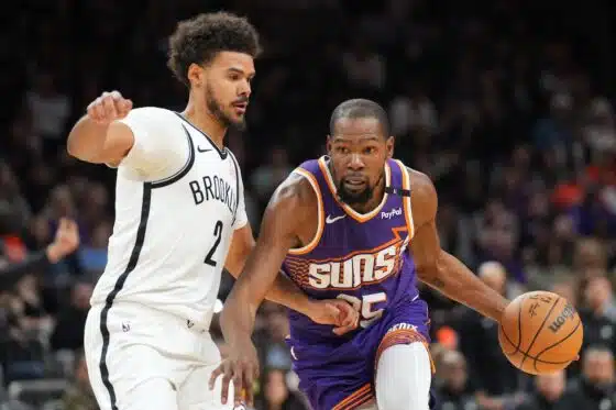 Durant dribbles against Johnson