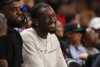 Mark Williams smiles at WNBA game